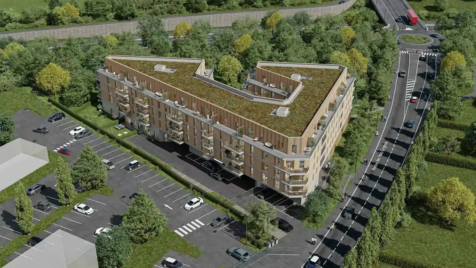 Vue aérienne 3D d'un programme résidentiel neuf avec toiture végétalisée, stationnements et voirie